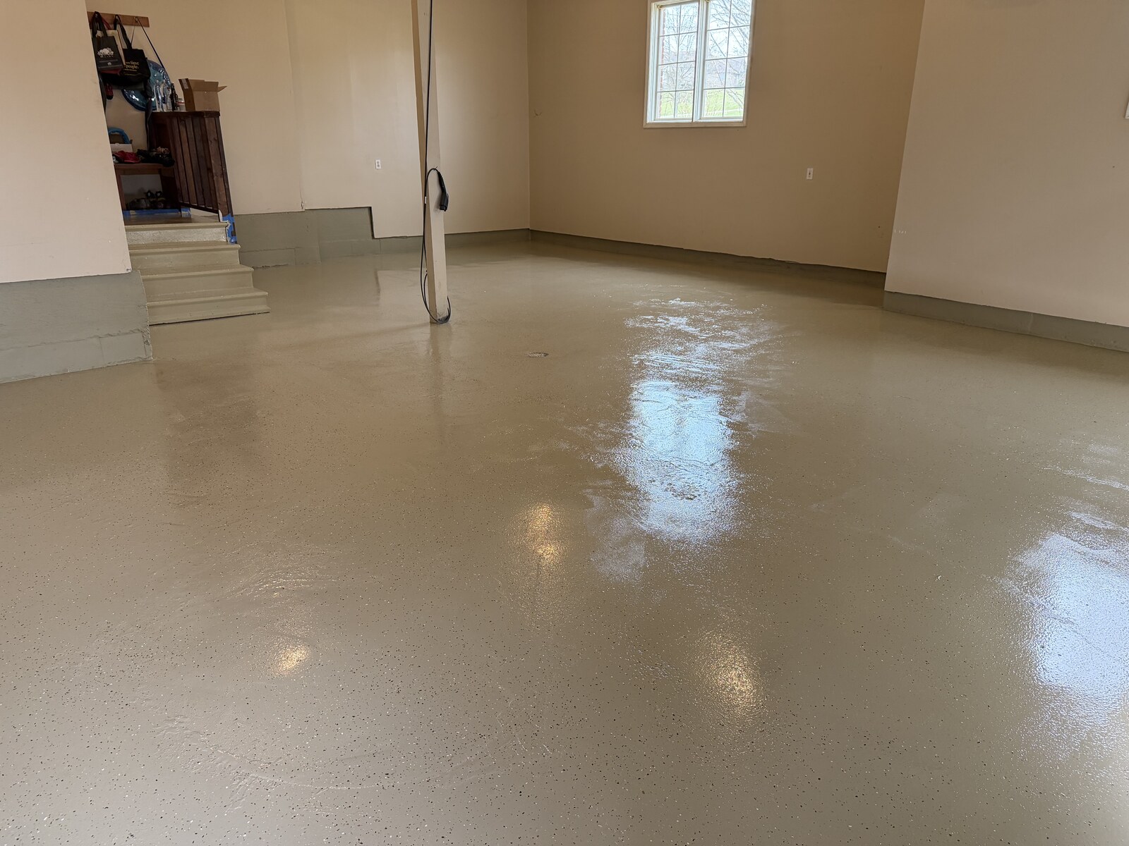 Final glossy finish across the garage floor.