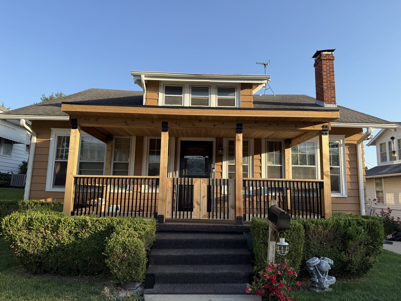 Front view of the finished porch with matching railings and center gate.